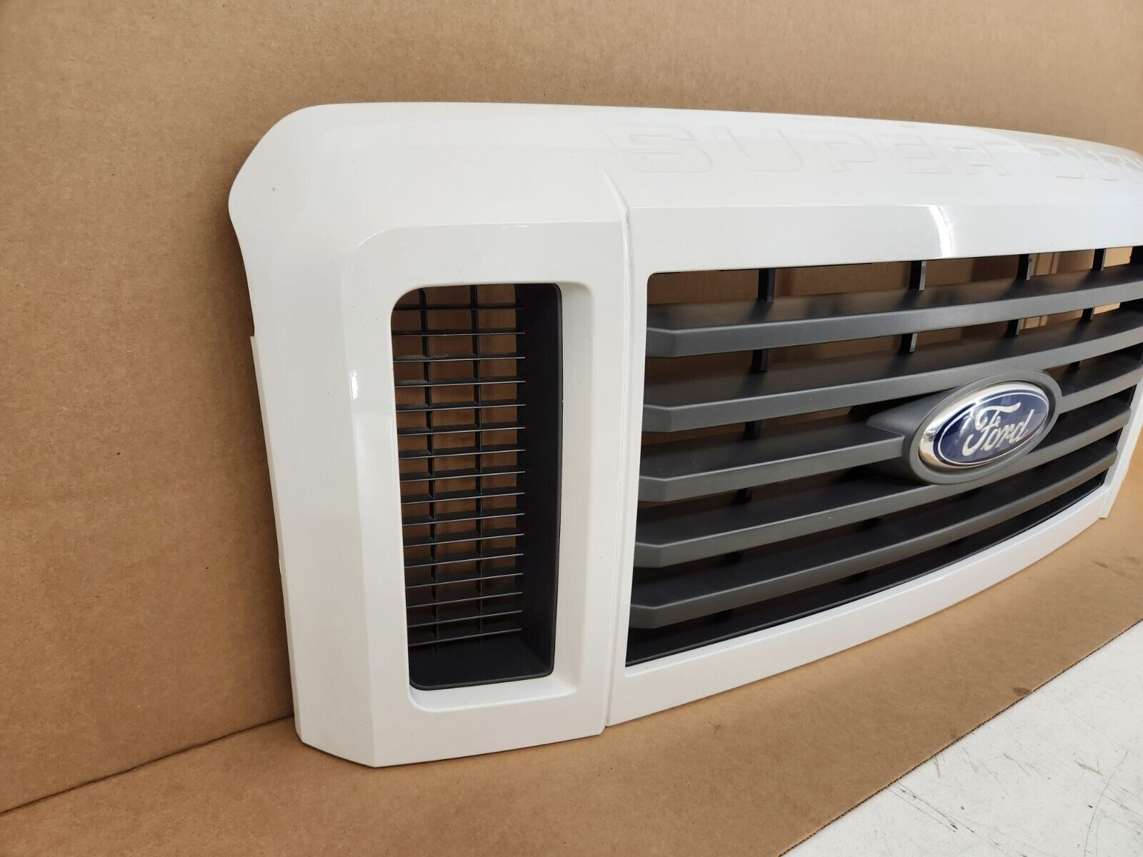 Second image of 2008-2010 Ford F250 F350 Super Duty FX4 Painted White Grille with Emblem, OEM